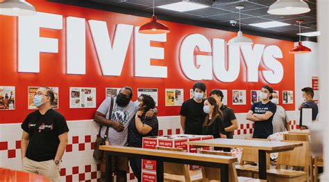 where was the first store built opened overseas five guys